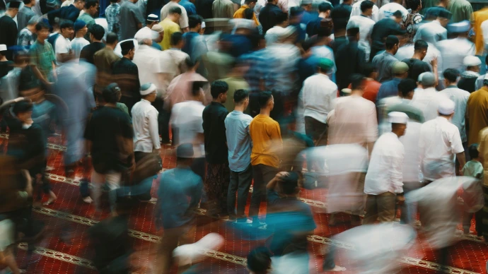 People are gathered, likely in prayer or worship.